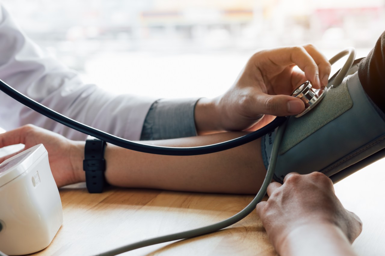 Arm of Doctor With Patient At Hospital, taking blood pressure