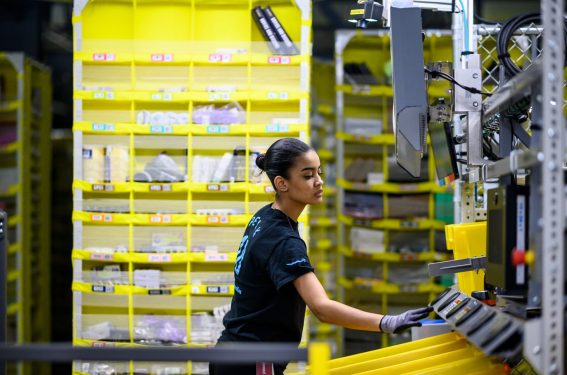 woman working at an Amazon distrubiton center