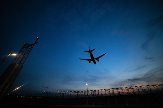 plan flying at dusk