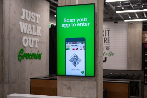 "Scan your app to enter" is displayed on a screen during a tour of a new Amazon Go store in the Capitol Hill neighborhood of Seattle, Washington, U.S., on Monday, Feb. 24, 2020. Amazon.com Inc. is taking aim at the urban grocery store, launching a version of its cashierless convenience store beefed up with baked goods, meat, produce and household items. Photographer: Chona Kasinger/Bloomberg via Getty Images