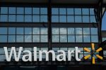 A Walmart logo is seen outside a store in Washington, DC, on August 18, 2020. (Photo by NICHOLAS KAMM / AFP) (Photo by NICHOLAS KAMM/AFP via Getty Images)