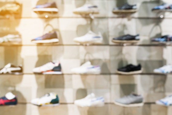 Shoes on shelves in shoes store