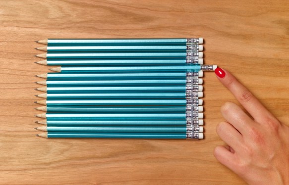 Teacher preparing pencils for school day; aligning product team with product vision