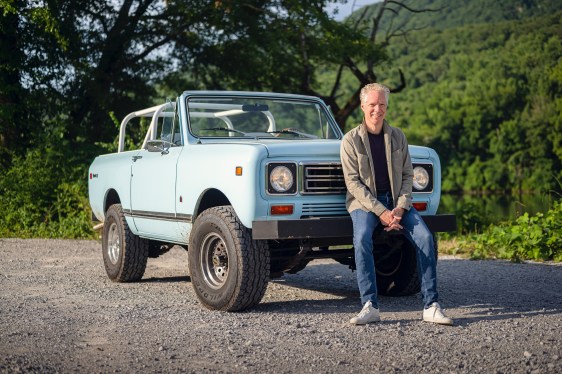 man sitting on front bumper of truck; Volkswagen Group of America CEO Scott Keough