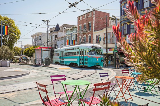 Castro Streetcar with Rainbow Flags in the streets of San Francisco, California, USA.