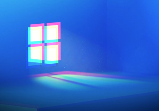 Windows logo blurred on a blue background.