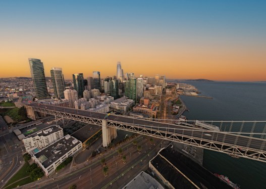 sunrise over the San Francisco Bay Bridge looking at the financial district in San Francisco.