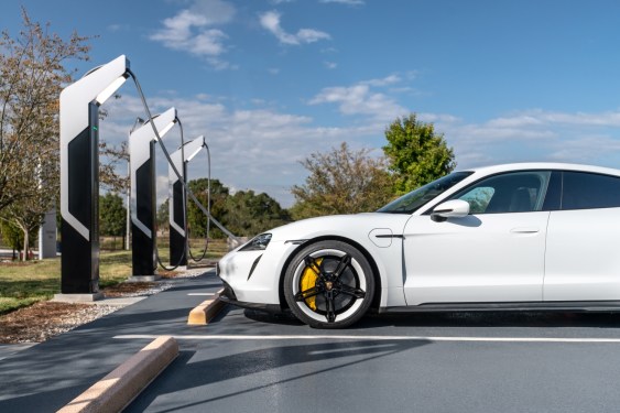 car at EV charging station