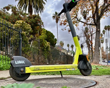 A shared scooter parked on a sidewalk in Koreatown, Los Angeles.