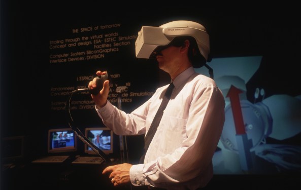 (Original Caption) A man explores a virtual reality exhibit designed by the European Space Agency (ESA) at the annual Le Bourget Aerospace Show north of Paris. (Photo by Alain Nogues/Sygma via Getty Images)