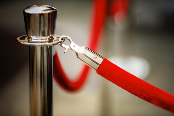 Close-up of red rope and stanchion