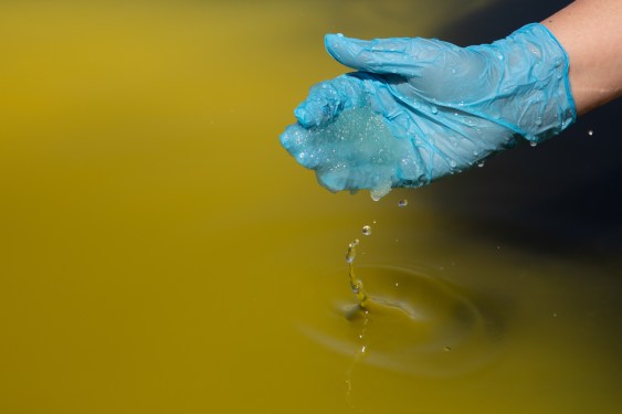 SALAR DE ATACAMA, CHILE - OCTOBER 25: A worker takes lithium brine at the mine in the Atacama Desert in Salar de Atacama, Chile on October 25, 2022. The Chemical and Mining Society of Chile (SQM) is expanding its mining operations in Salar de Atacama to meet the growing global demand for lithium carbonate, the main ingredient in battery production for electric vehicles. Chile is the world's second largest producer of lithium after Australia. (Photo by Lucas Aguayo Araos/Anadolu Agency via Getty Images)