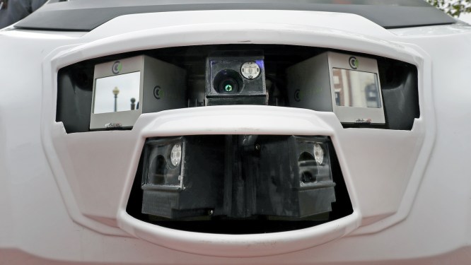 A closeup of sensors on May Mobility's autonomous vehicle.