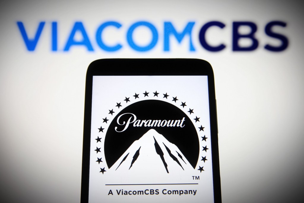 a photo of the Paramount logo on a phone surrounded by ViacomCBS' logo