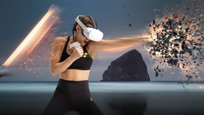 A woman wearing a headset doing a boxing workout in VR