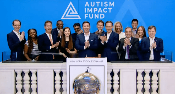 People from the Autism Impact Fund ring the closing bell at the NYSE