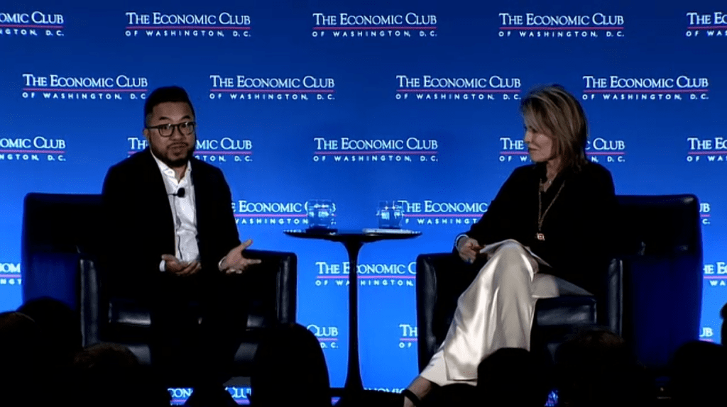 Garry Tan speaking with Teresa Carlson at The Economic Club of Washington, D.C. event