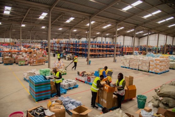 workers in a warehouse fulfilling orders