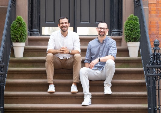 Harmonyze founders sitting on steps