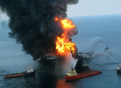 a photo of fire boat response crews battle the blazing remnants of the off shore oil rig Deepwater Horizon in the Gulf of Mexico