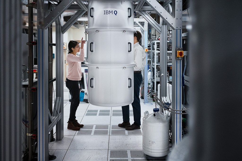 Neerja Sundaresan, Research Team Member, IBM Research, talking to Douglas McClure, next to IBM Q System One quantum computer