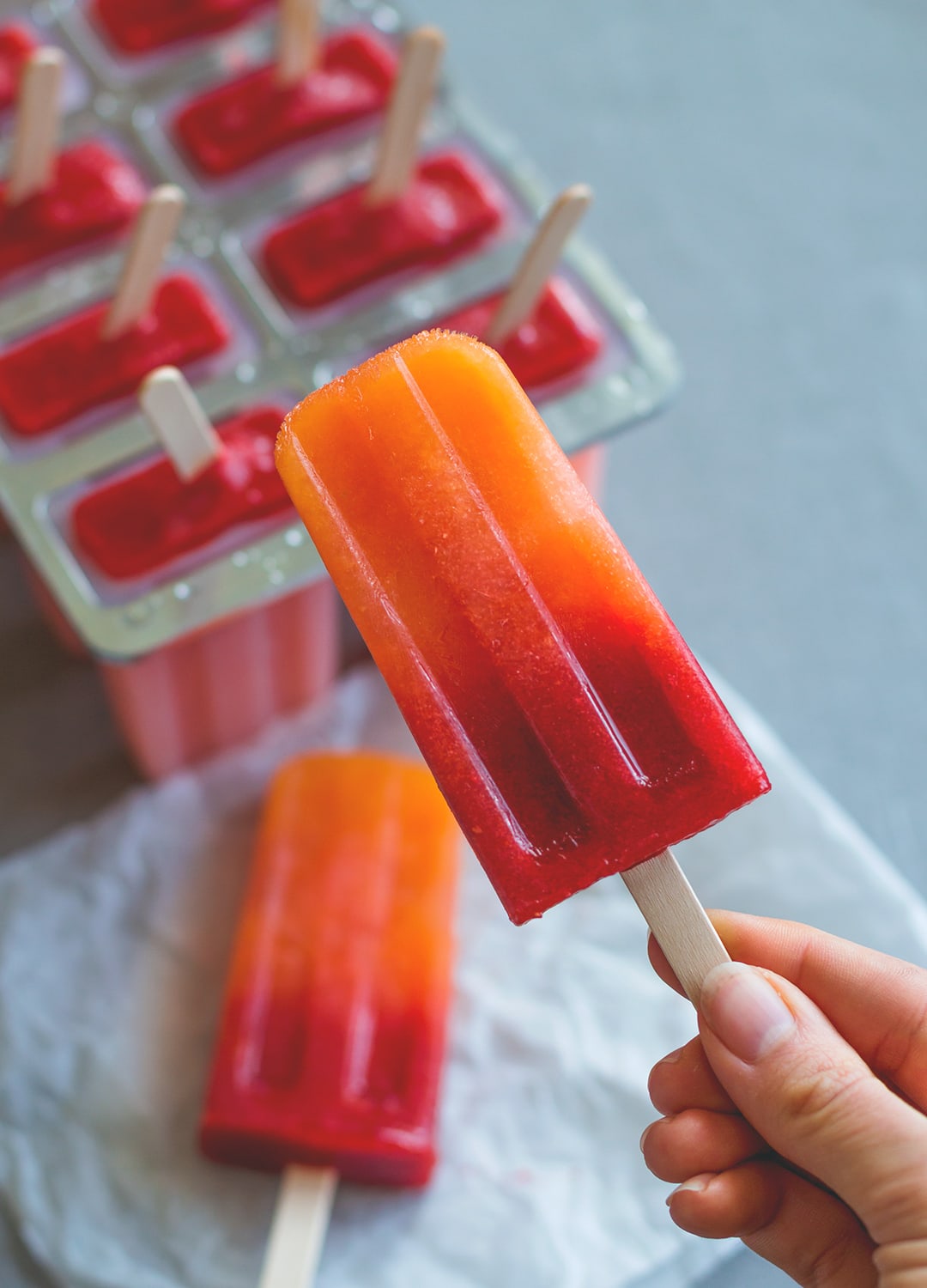 Orange Strawberry Sunrise Popsicles - treat yourself with homemade popsicles this summer. We LOVE these! They're easy to make, delicious, and actually healthy! (raw vegan) | thehealthfulideas.com