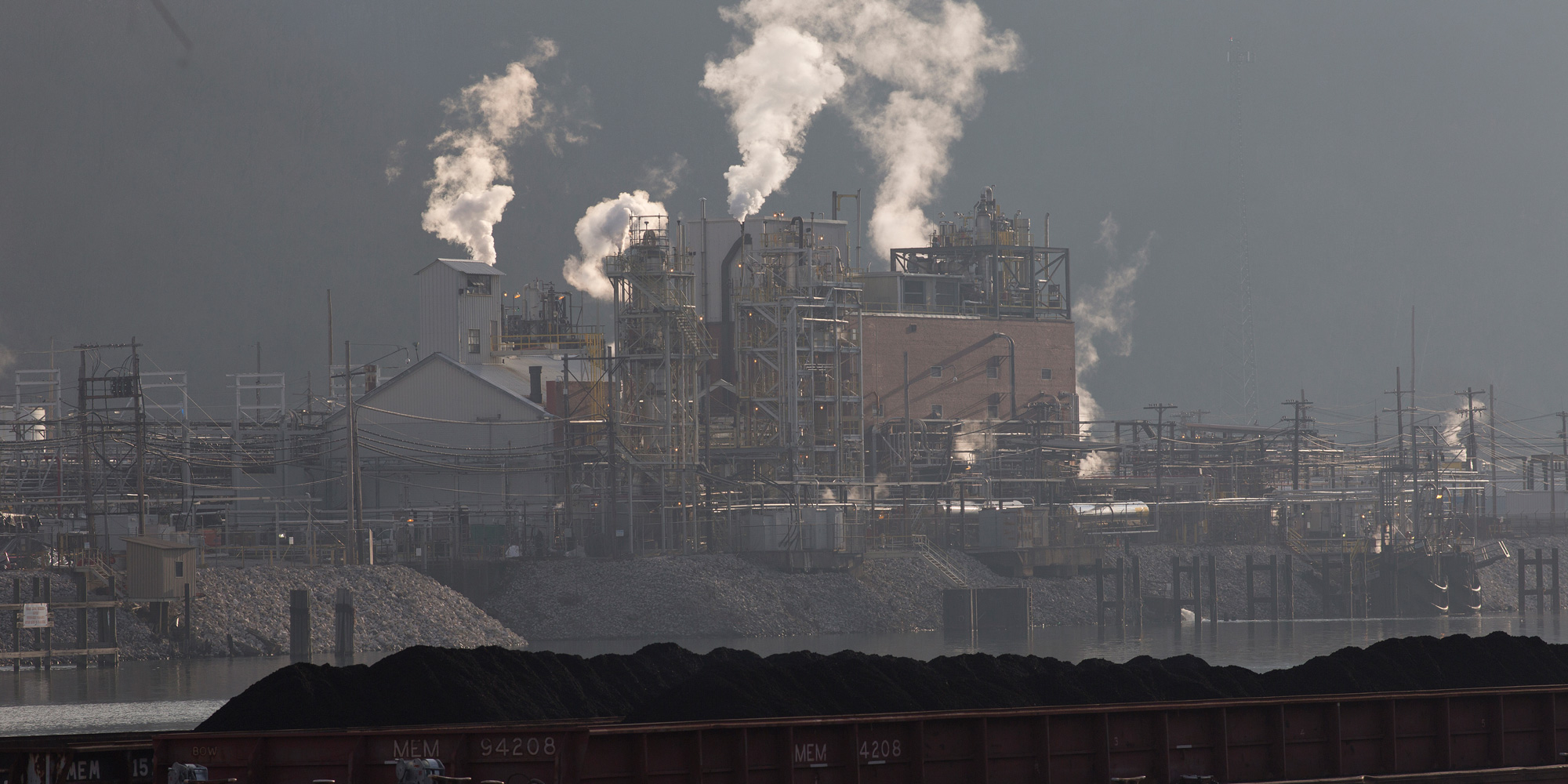 Just south of Charleston a coal barge travels up the Kanawha River, passing the Dupont chemical plant. (Photo by Andrew Lichtenstein/Corbis via Getty Images)