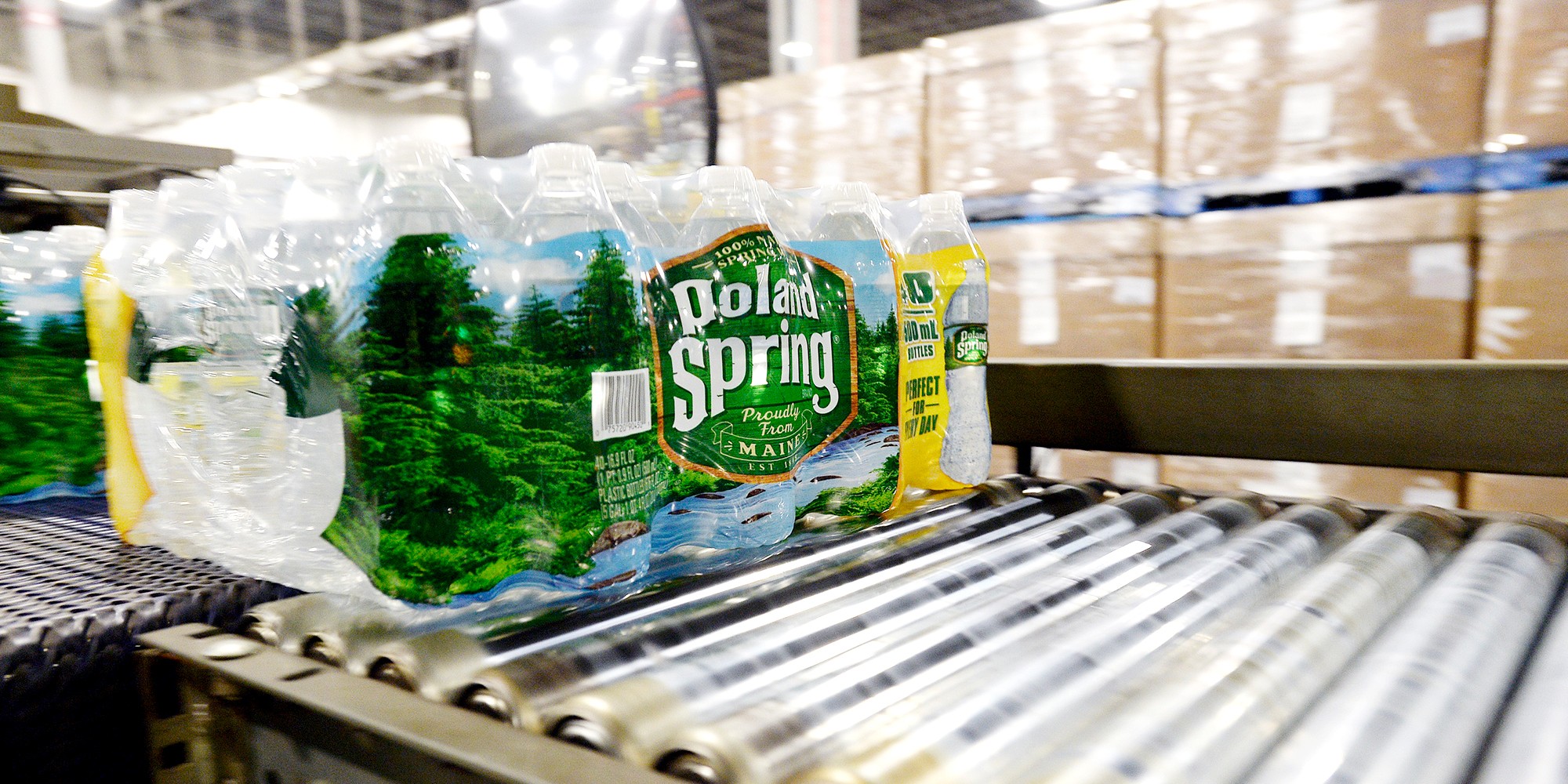 Packaged bottles of Poland Spring water on a conveyer belt, 2016.