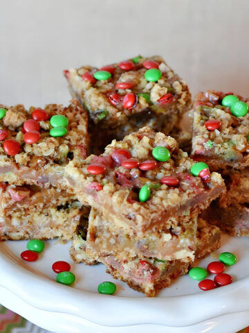 Christmas Caramel Bars on a dessert stand