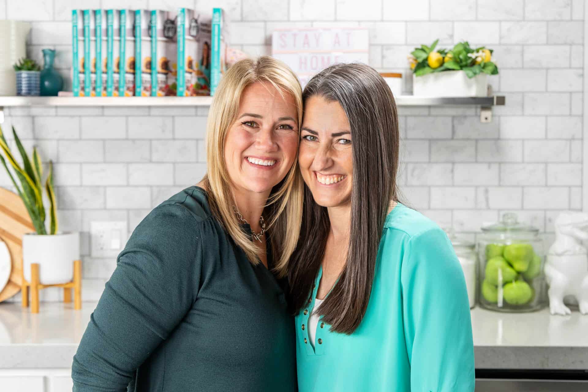 A photo of Chef Caytlin McCleery and Chef Rachel Farnsworth in the studio kitchen of The Stay At Home Chef.