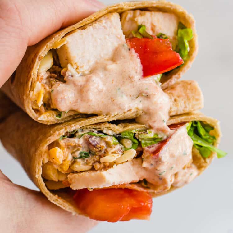 hand holding southwest chicken wraps