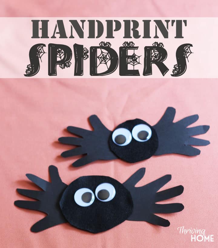 Handprint Spiders Halloween Craft - preschool hands cut out of black construction paper with a black circle glued between them and googly eyes on top.