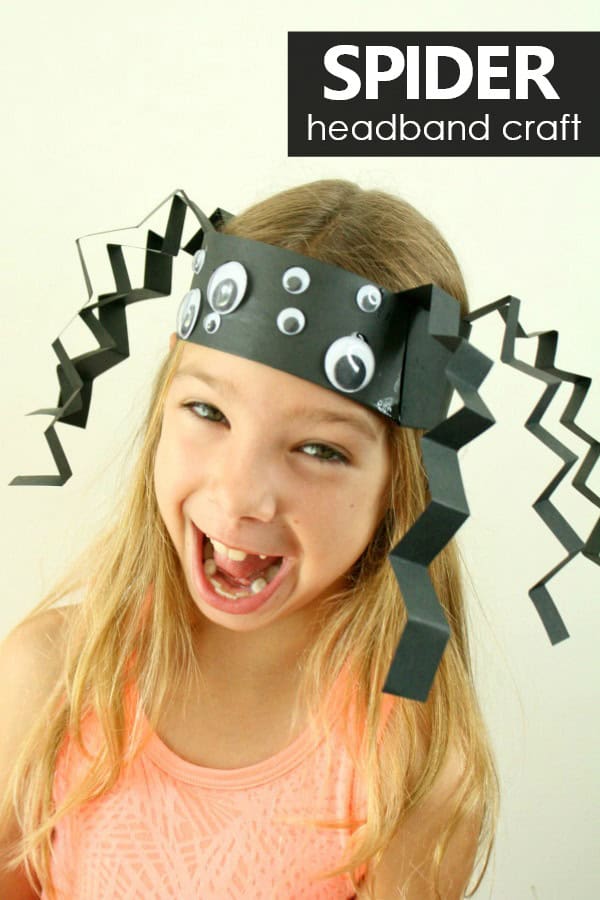 Spider headband craft for kids made of black construction paper and googly eyes.