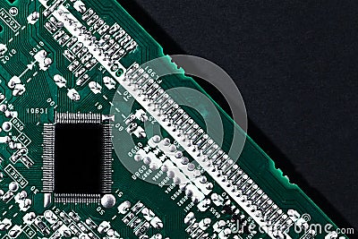 Microchip integrated on green motherboard computer science Stock Photo