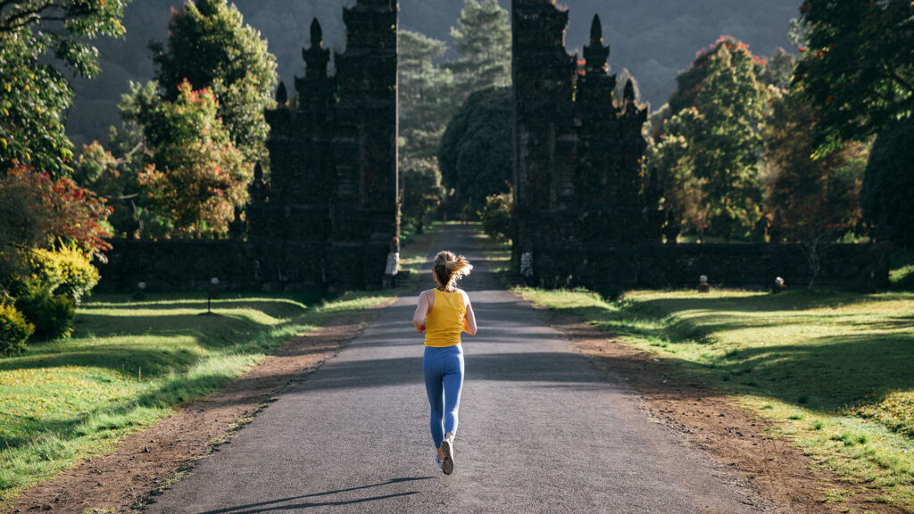 woman jogging in bali, indonesia