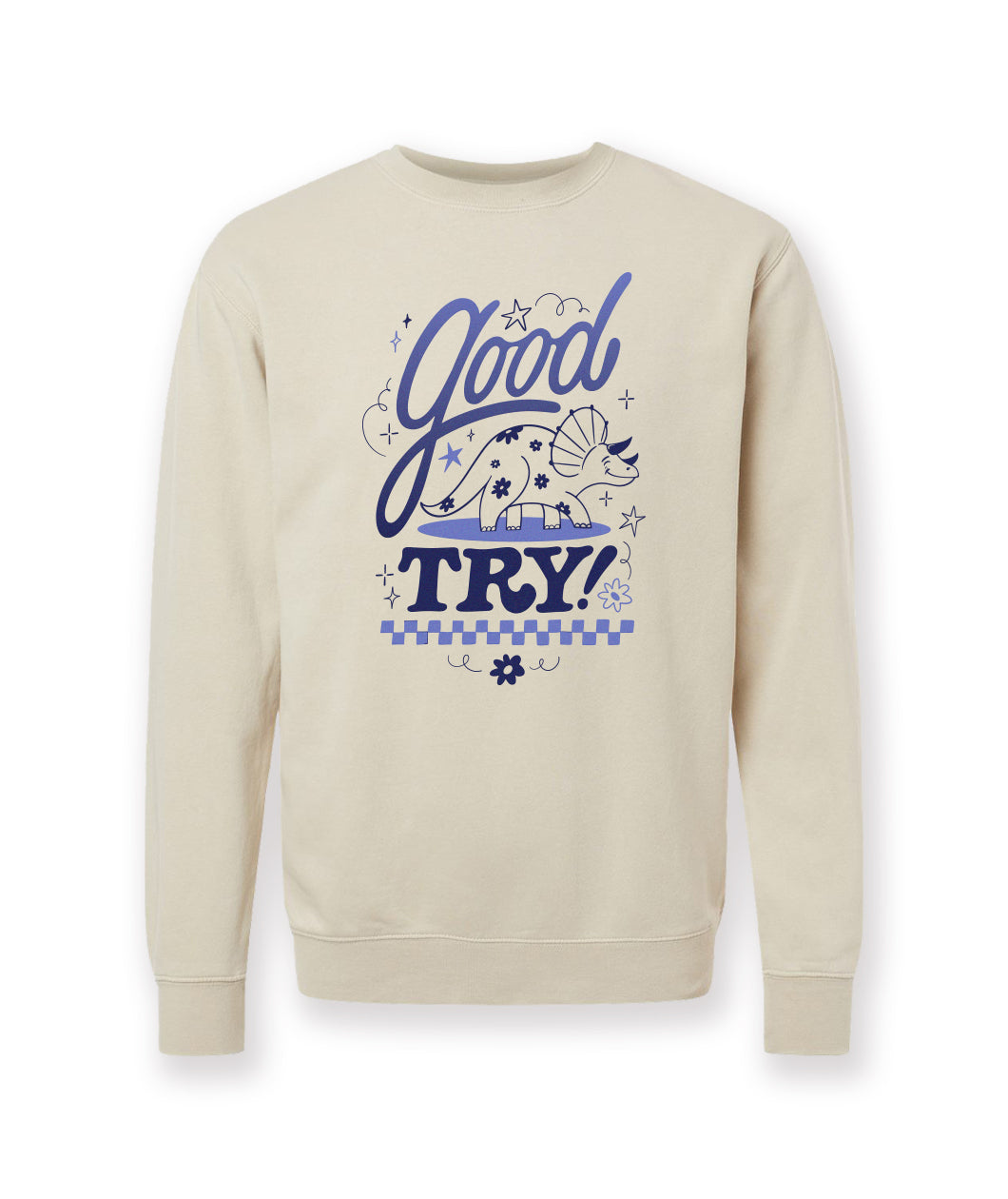 An off-white crewneck sweatshirt with a design printed on the front. The design is of a smiling triceratops surrounded by the phrase, "Good try!" From the Try Guys.