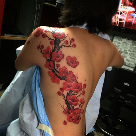 japanese cherry blossom tattoo on back - Cassondra Pelletier