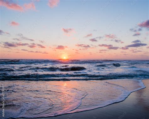 Ocean Sunrise over waves Stock Photo | Adobe Stock