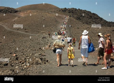 Guided tour on Santorini volcano Stock Photo - Alamy