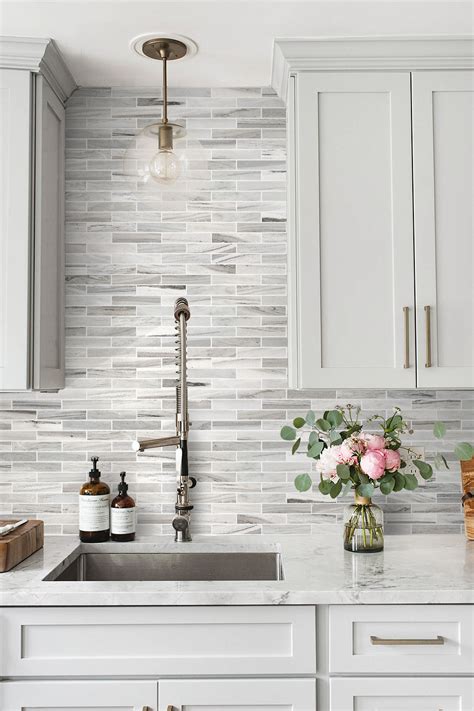 Daydreaming about this incredible marble subway tile in our MarinHillsideCottage kitchen. Photo