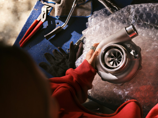 person working on a car part