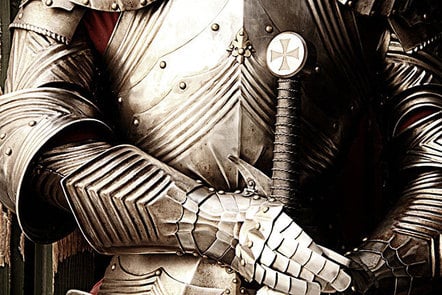 A suit of armour with the hilt of a sword.