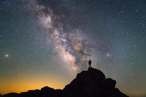 Milky Way. Night sky and silhouette of a standing man