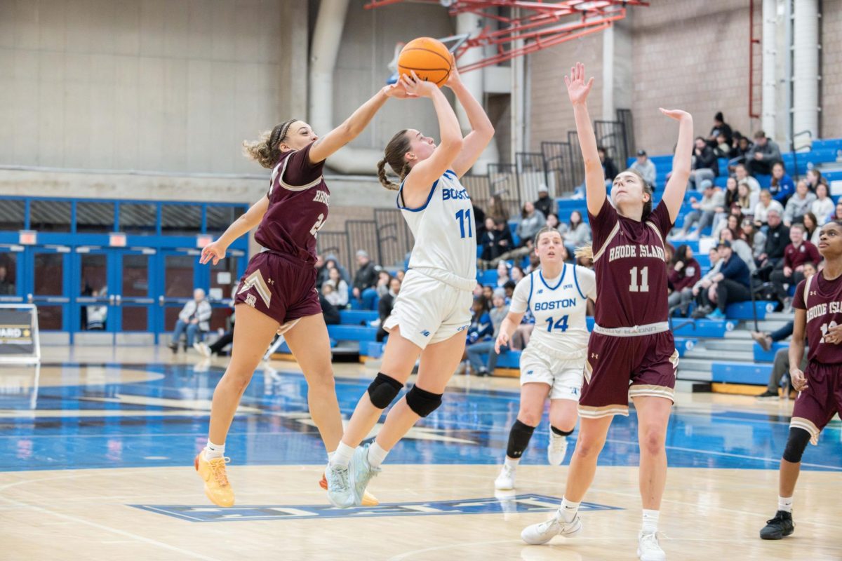 Forward Keriann Farina shoots the ball against Rhode Island College at a home game on Jan 27. Photo by Dong Woo Im/ Mass Media Staff.