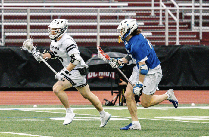 Player Luke Murphy drives towards the goal at a home game. Photo by Dong Woo Im / Mass Media Staff.