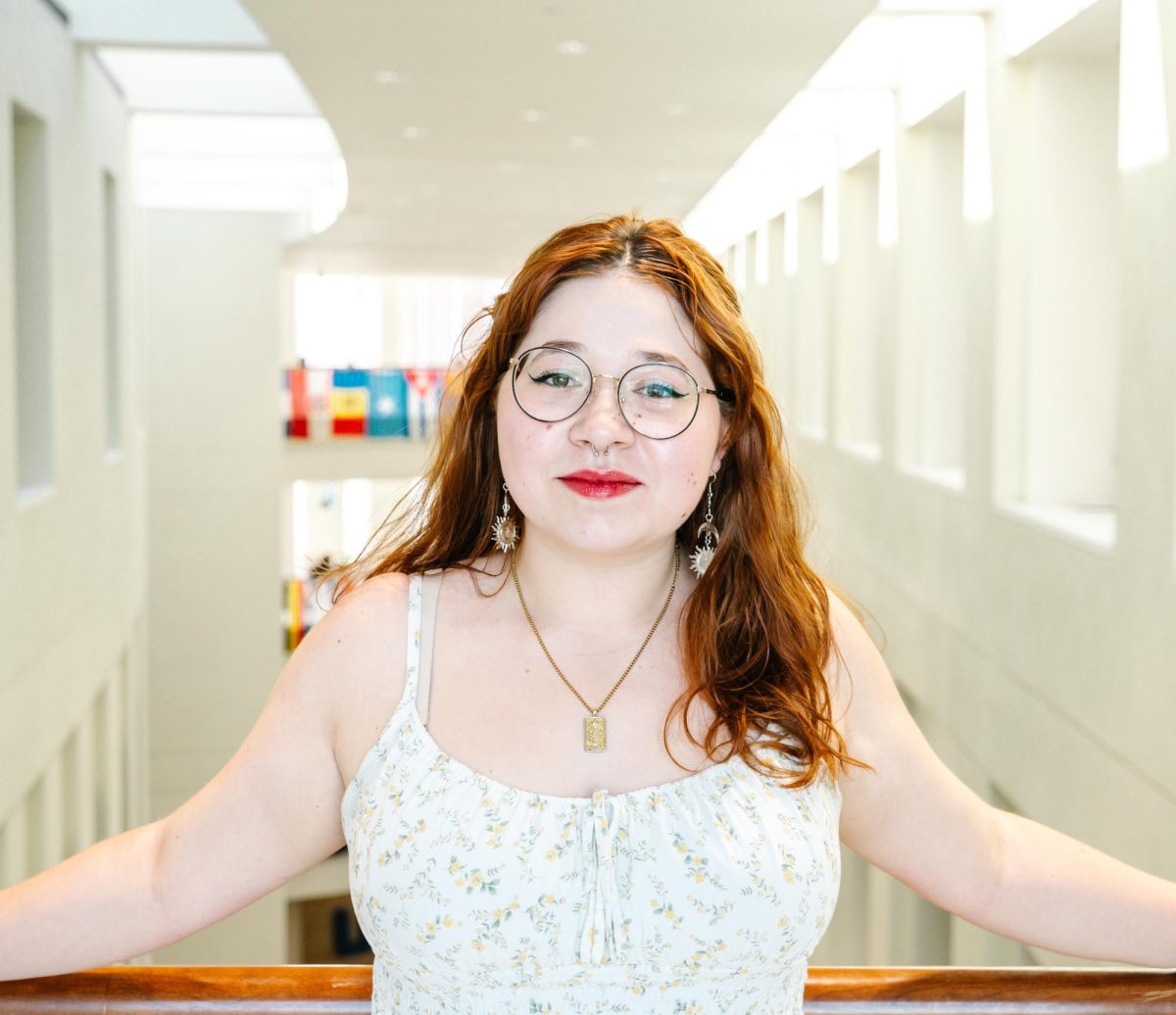 Graduating Editor-in-Chief Katrina Sanville poses for a photo in the Campus Center.  Photo by Olivia Reid / Photography Editor