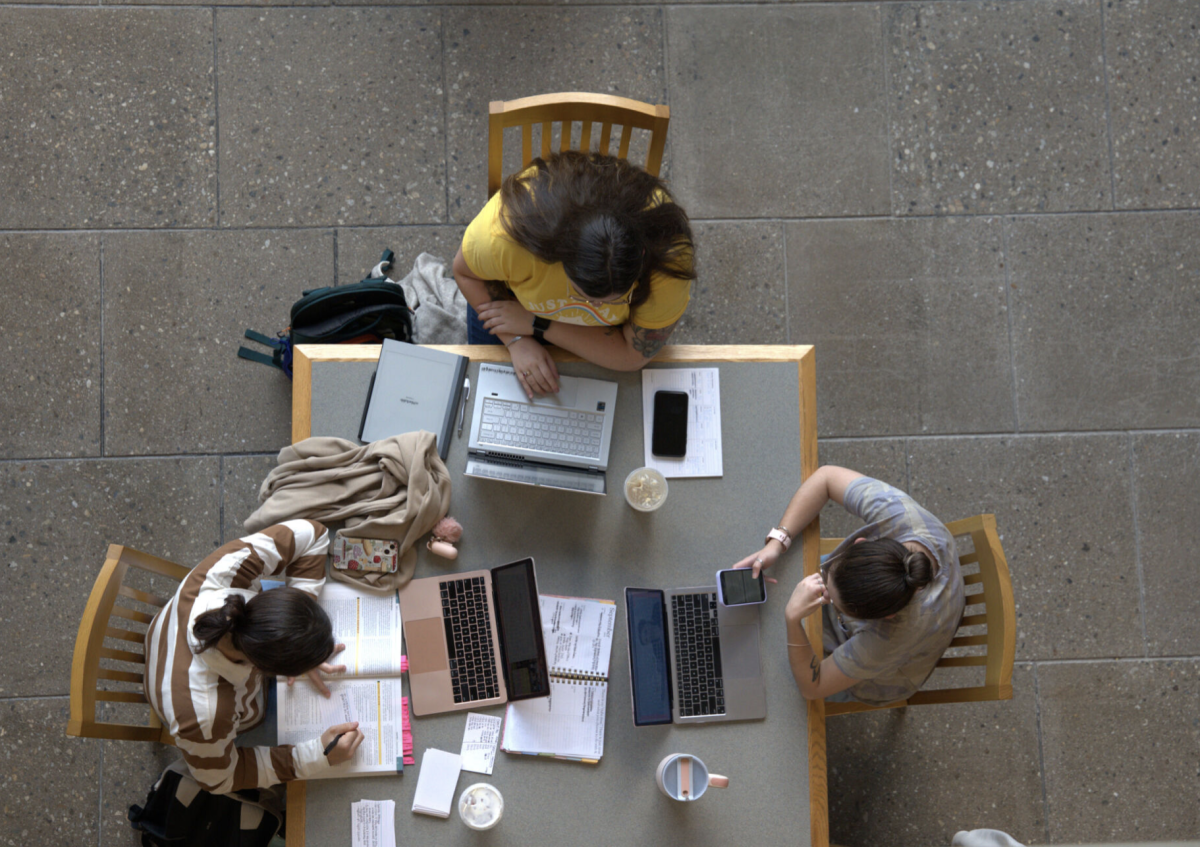 Students work on homework in the Quinn Administration Building. Photo by Olivia Reid/ Photography Editor.