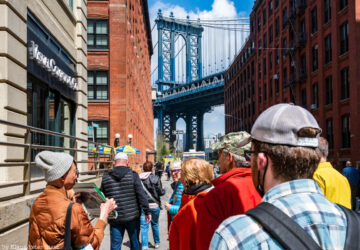 Tour group in front of the Manhattan Bridge in DUMBO