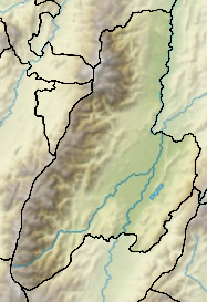Mapa konturowa Tolima, u góry znajduje się czarny trójkącik z opisem „Nevado del Tolima”