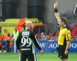 Stig Tøfting takes a yellow card (2007).jpg